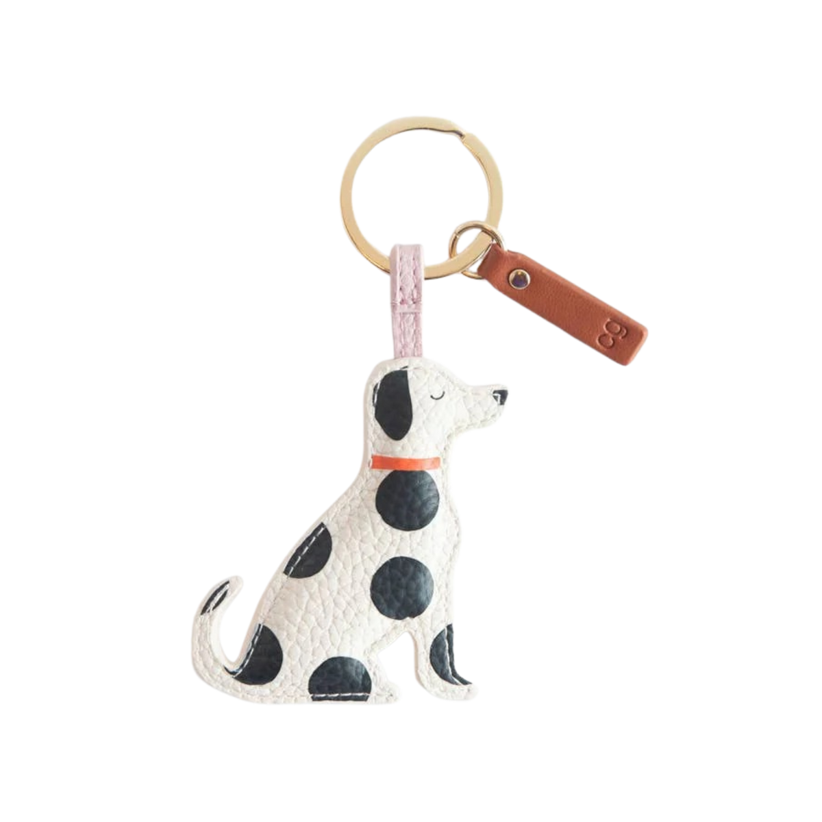 Dog-shaped keychain with polka dot pattern on a white background