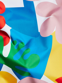 Colorful abstract pattern with shapes in red, blue, green, yellow, and pink on a white background.