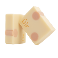 Two bars of hand and body soap with a delicate pattern on a white background, featuring the brand name 'Oir'.