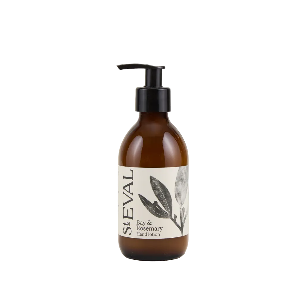 Brown bottle of St. Eval Bay & Rosemary hand lotion on a light beige background