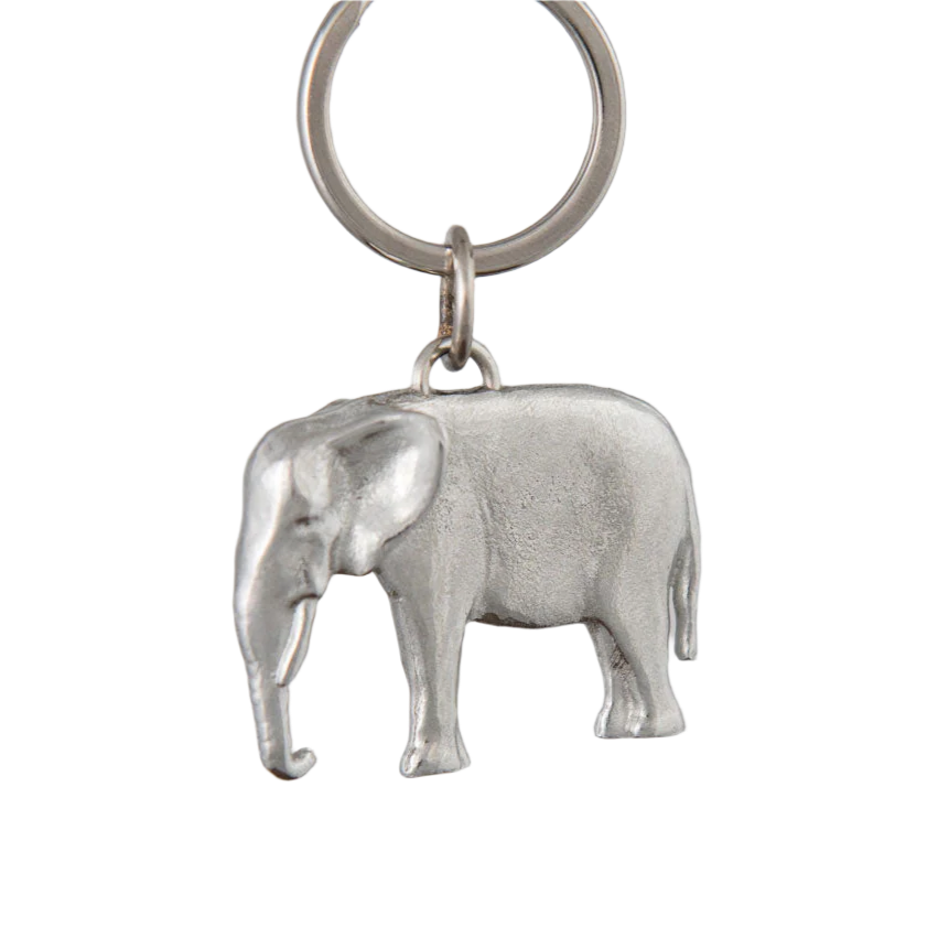 Silver elephant keychain on a gray background