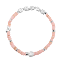 Bracelet with pink beads and silver charms on a white background