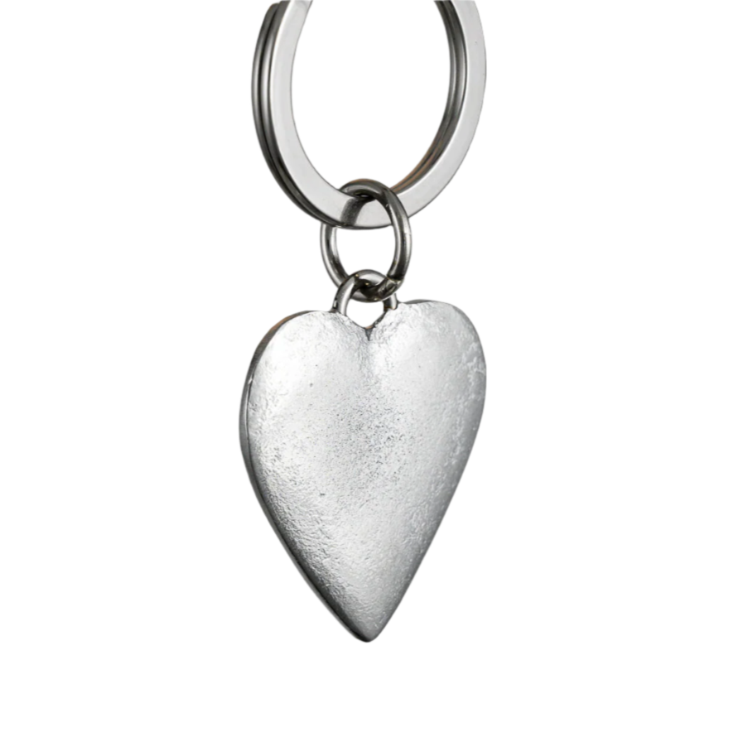 Silver heart-shaped keychain on a gray background