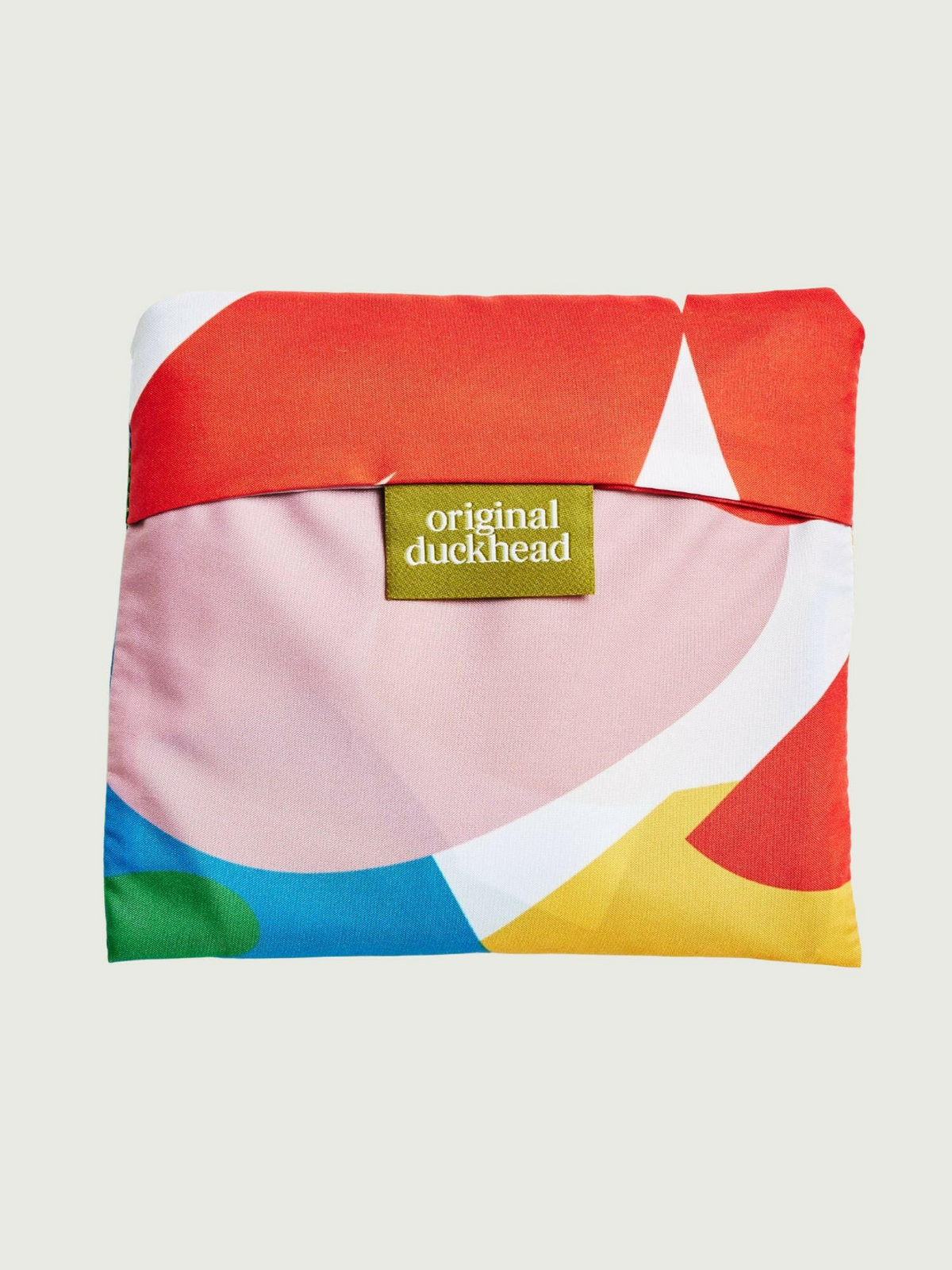 Colorful pouch with geometric design and 'original duckhead' tag on a light background